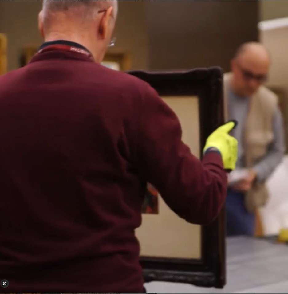 Man Holding Painting